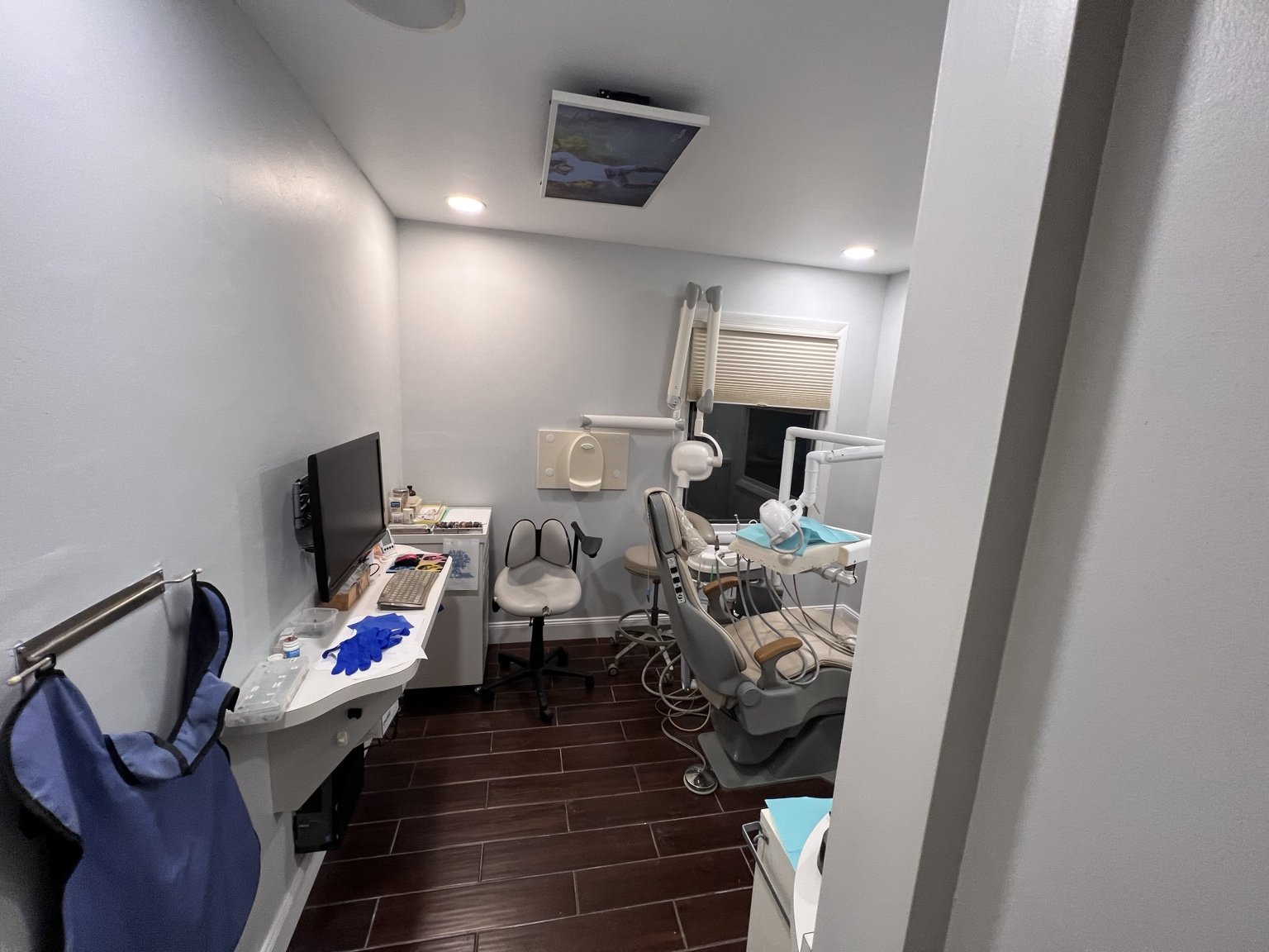 Finished commercial treatment room with painted walls and flooring
