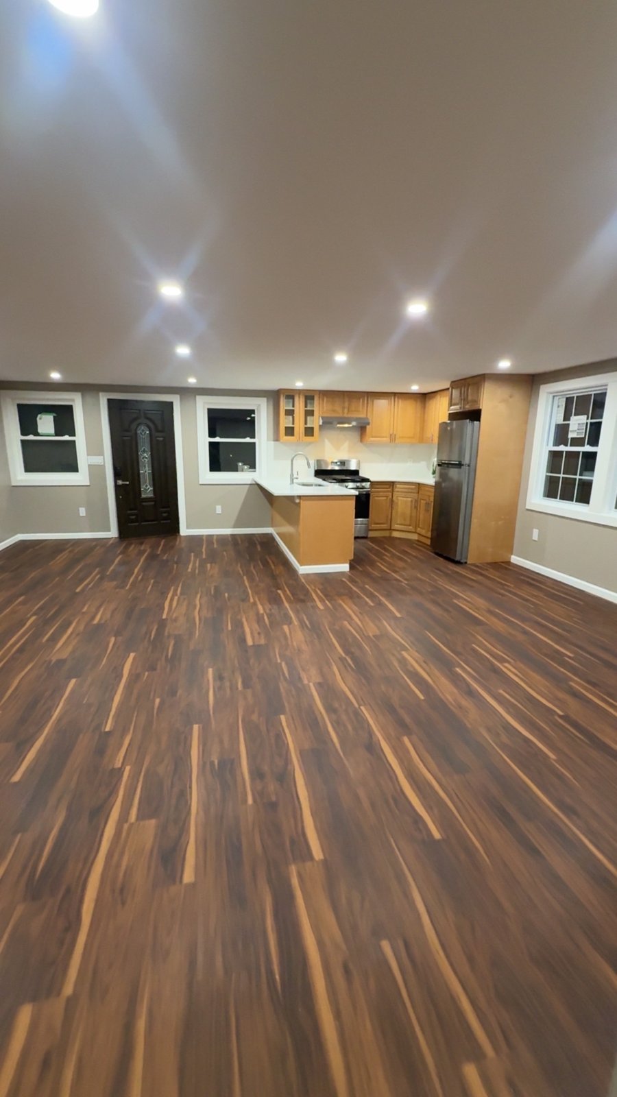 Finished open living space and kitchenette