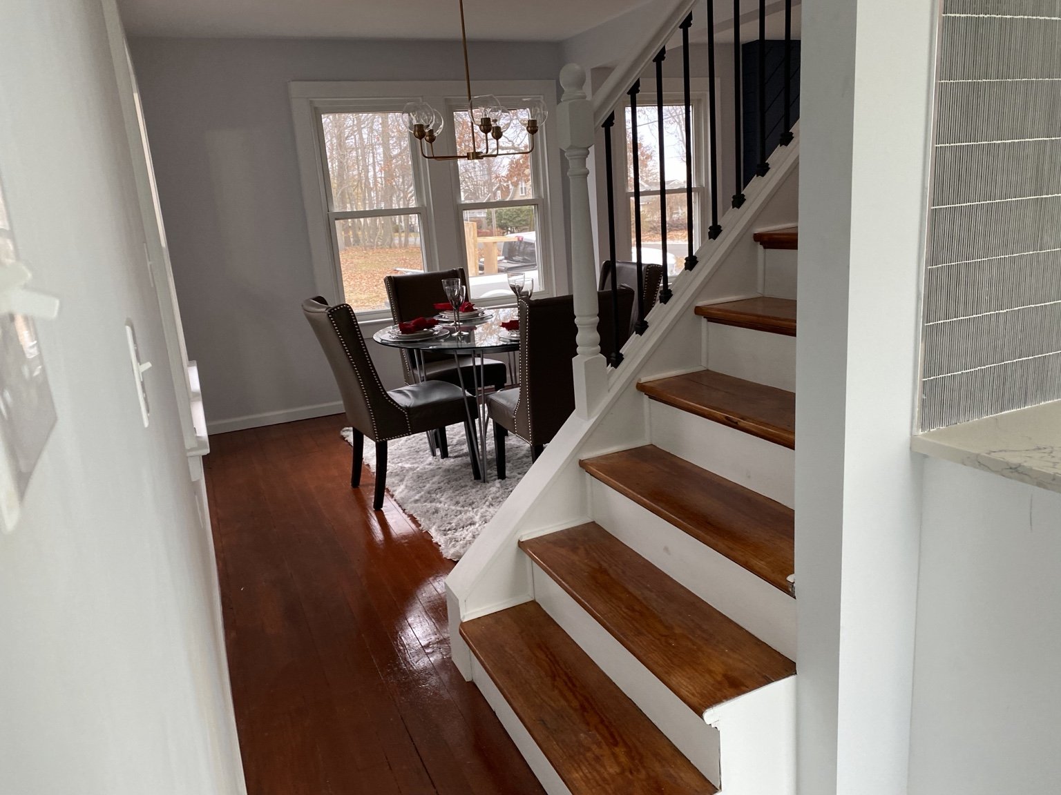 Wood staircase with painted trim and railings